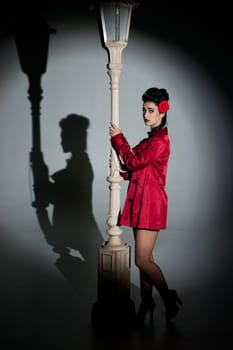 beautiful young glamorous woman  with lightpole