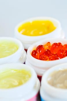 Colorful jars of skin care creams and lotions