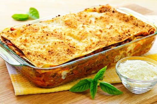 Fresh baked lasagna casserole with grated parmesan cheese