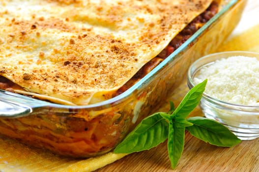 Fresh baked lasagna casserole with grated parmesan cheese