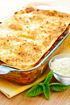 Fresh baked lasagna casserole with grated parmesan cheese