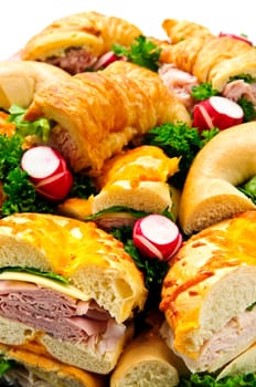 Assorted platter of sandwiches with meat and vegetables