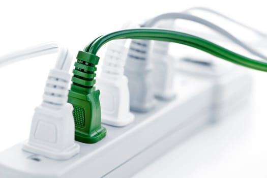 Many plugs plugged into electric power bar