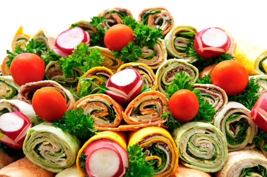 Closeup on platter of assorted meat tortilla wraps
