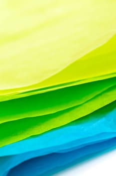 Close up of blue green and yellow tissue paper