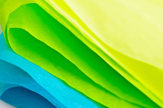Close up of blue green and yellow tissue paper