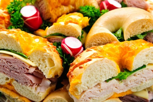 Assorted bagel sandwich platter with meat and vegetables