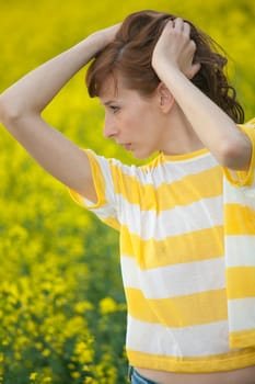 happy woman resting in yellow field