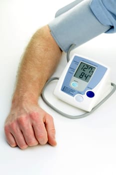 Readings from a self checkup blood pressure machine are displayed digitally.