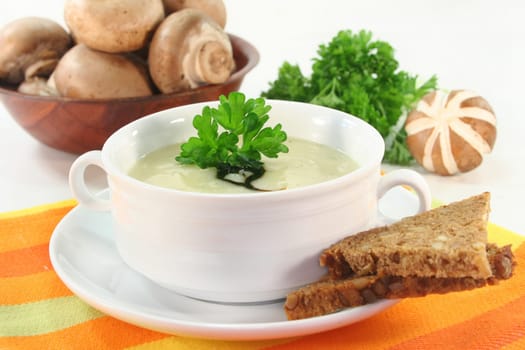 a bowl of cream of mushroom soup with fresh ingredients