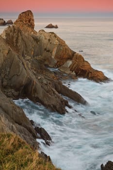 Amazing seascape sunrise at winter. Los Urros, Spain