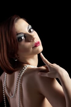 Woman portrait with fur boa in retro style make-up