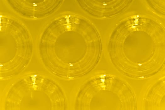 Detail Macro Shot of Yellow Glass Ampoules