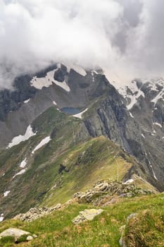 a small mountain lake in the background