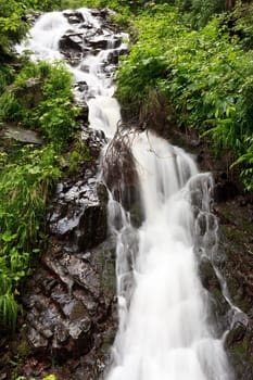 a mountain stream that flows like a waterfall