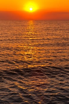 reflection of sunlight on the water at sunrise