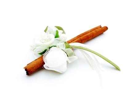 Cinnamon stick decorated with bonbons and ribbon. Wedding gift.