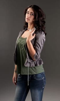 beuatiful young fashion teenager on dark gray