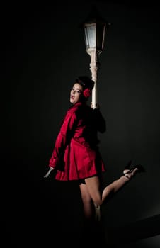 beautiful young glamorous woman  with lightpole
