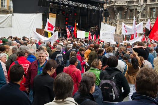 MUNICH,GERMANY - MAY 1st 2011: Many people participating in the rally at Munichs central Marienplatz in May Day,the international labour day,protesting against cuts in social welfare and low wages. May 1st,2011 in Munich,Germany.