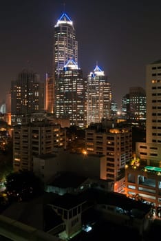 The illuminated skyscrapers of Bangkok's business district around Silom road at night