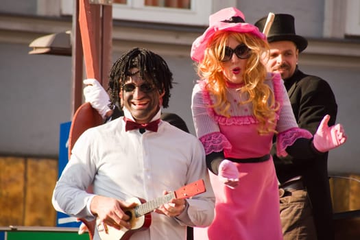 VILLACH,AUSTRIA - MARCH 5,2011: Masked musicians and jugglers took the street at the annual carnival procession held on March 5,2011 in Villach,Austria. Participants come from Austria,Italy and Slovenia.
