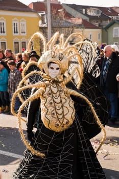 VILLACH,AUSTRIA - MARCH 5: A giant spider took the street at the annual carnival procession held on Mar. 5,2011 in Villach,Austria. Participants come from Austria,Italy and Slovenia.