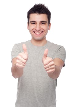 handsome young man with thumbs up on an isolated white background