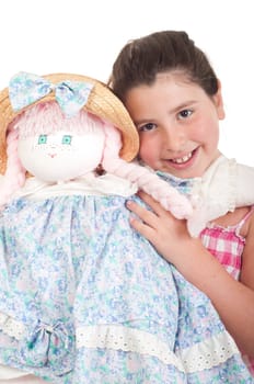 joyful little girl with her favorite doll (isolated on white background)