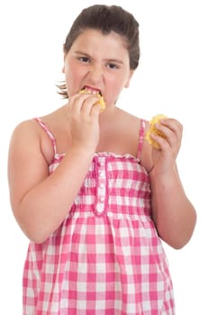 cute little girl with hungry expression eating chips (isolated on white background)