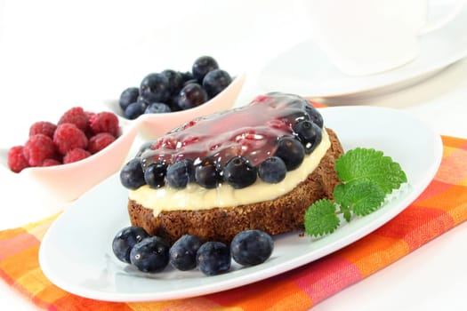 a forest fruit tart on a cake server