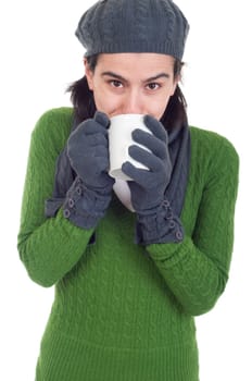 close up of a winter woman drinking hot coffee/tea (isolated on white background)