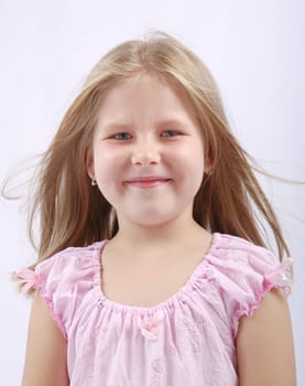 Studio portrait of cute child with blowing hair