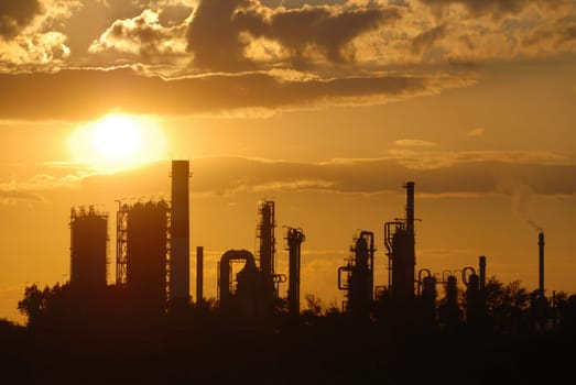 Oil refinery at sunset