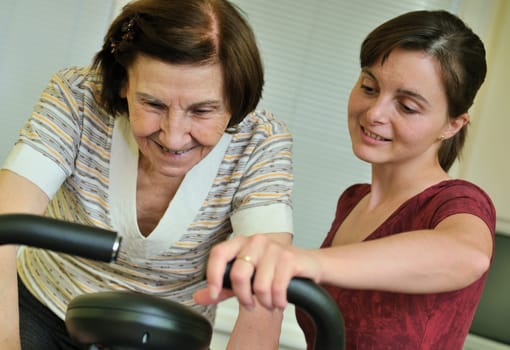 Spinning senior woman (80ty something) with coach
