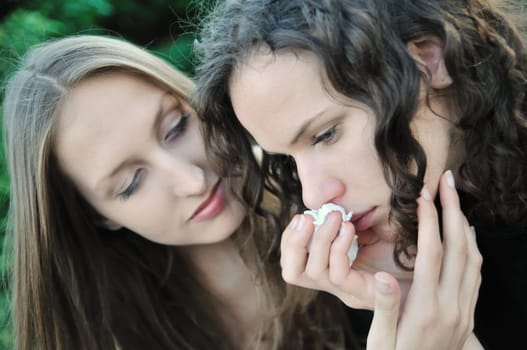 Friends series - detail of two teenage girls, one comforts and regrets another