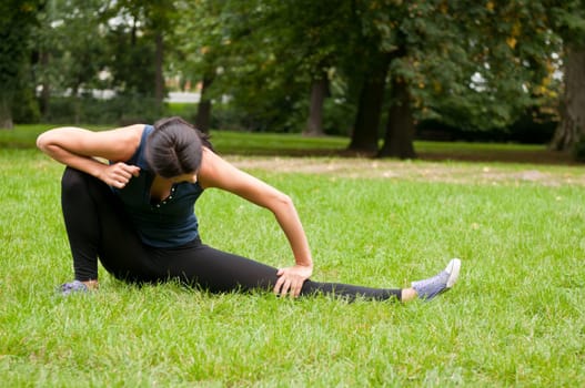 Woman stretching muscles before jogging