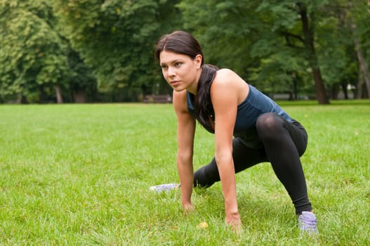 Woman stretching muscles before jogging