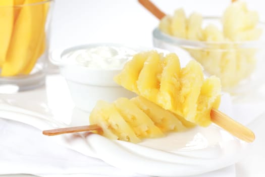 Healthy snack - Pineapple skewer with curd cheese or yogurt