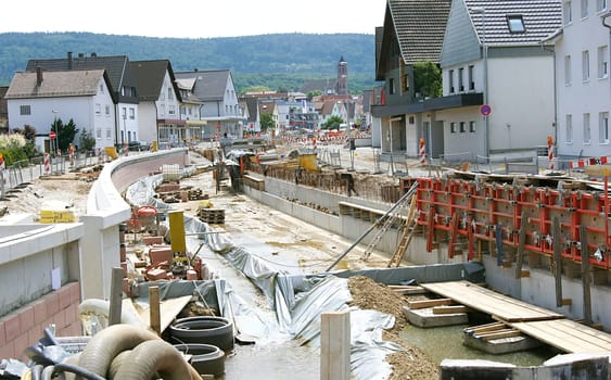 Road construction and disclosure of the village stream