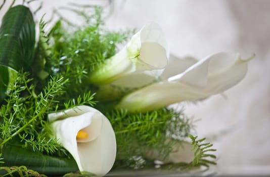 wedding bouquet on the table, bride in background