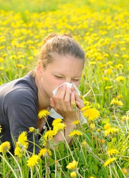 Young woman with handkerchief on a meadow