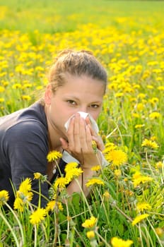 Young woman with handkerchief on a meadow