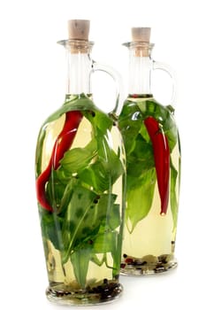 Two bottles of wild garlic oil against a white background