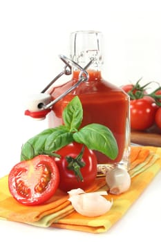 a bottle of tomato ketchup with fresh ingredients