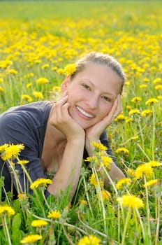 Young woman on a flower meadow