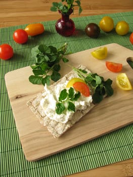 Cream cheese with watercress on crispbread