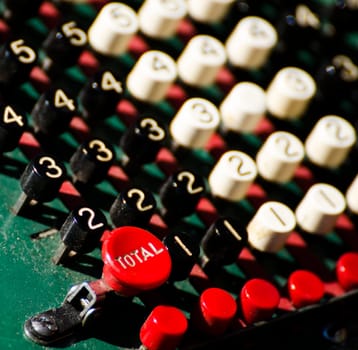 a close-up of the keys of an old calculator