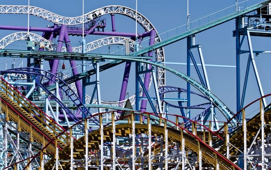 several roller-coaster tracks at an amusement park