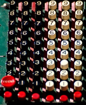 a close-up of the keys of an old calculator